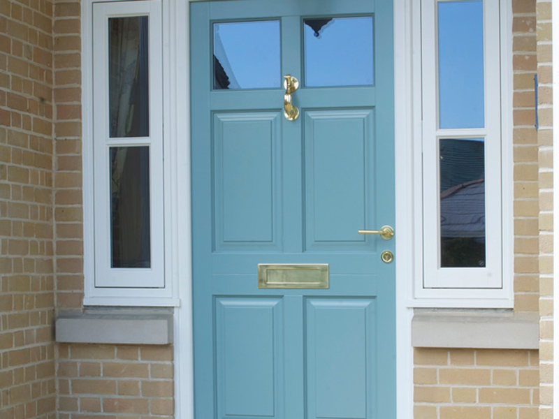 blue front entrance door top side light brass furniture